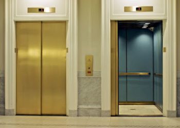 facing twin elevators on first floor, one is open; Shutterstock ID 23743729; PO: aol; Job: production; Client: drone
